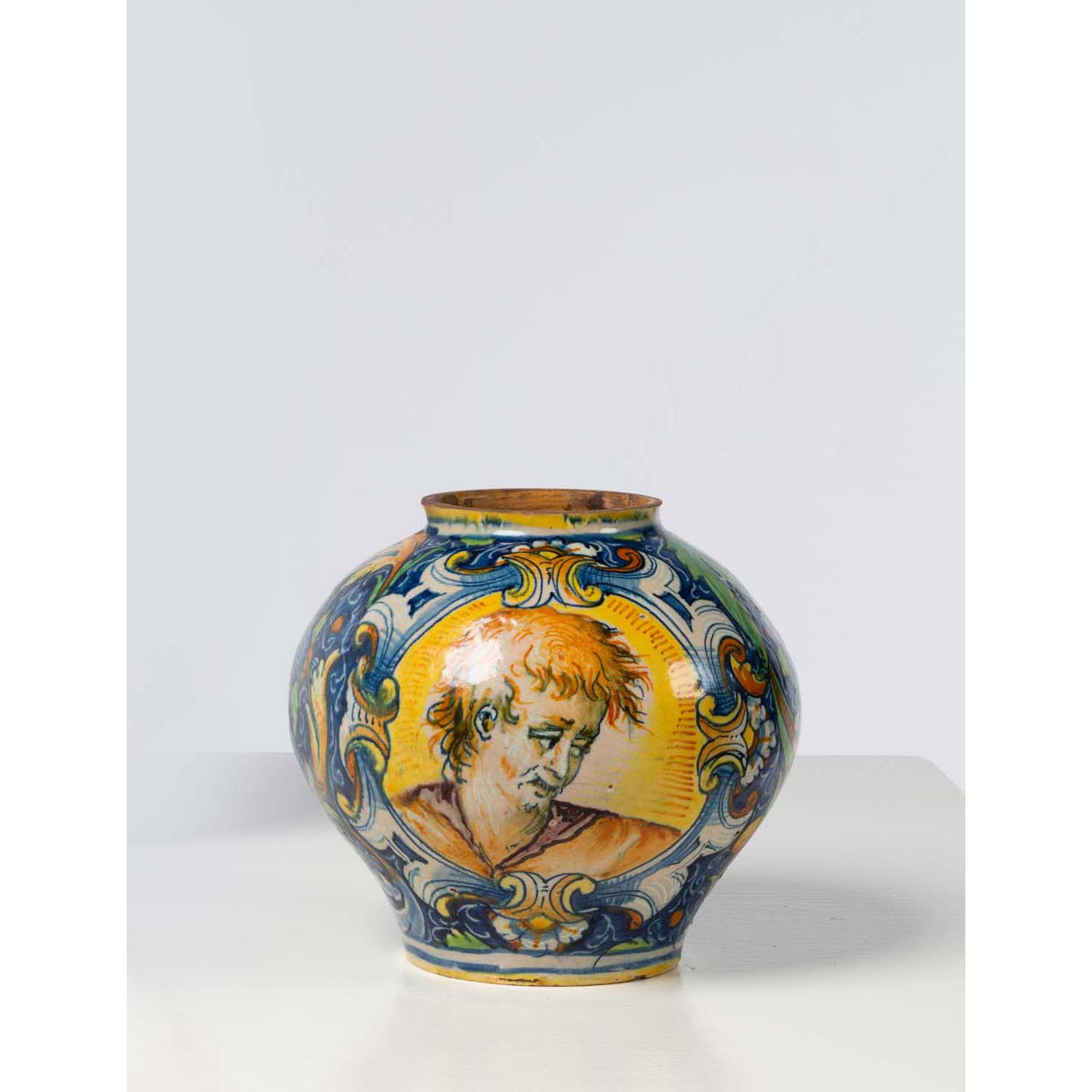 Venice Majolica ball vase with polychrome decoration of a portrait of a man  and a portrait of a womanin two medallions on a background