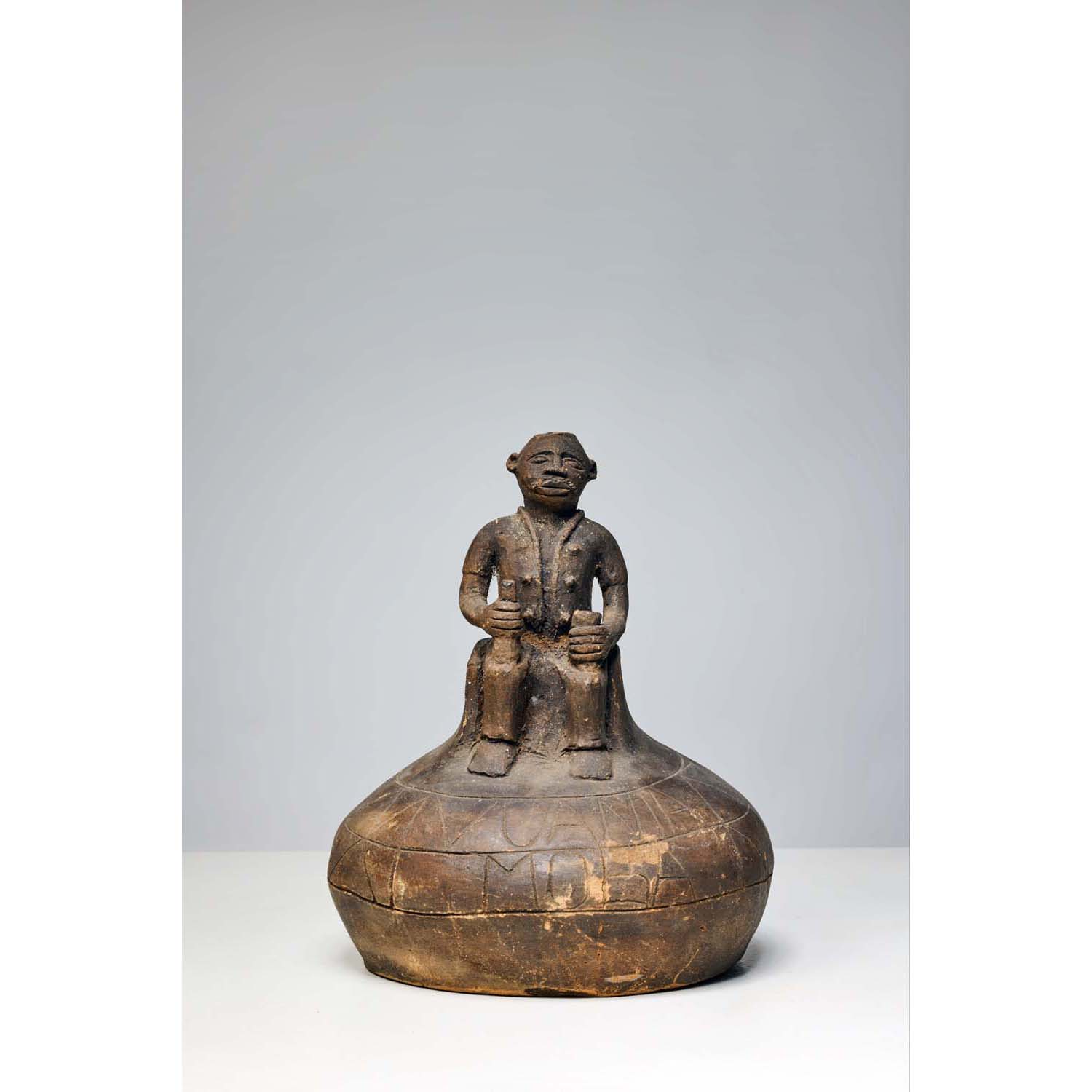 Bakongo jar representing a seated man Work signed by Voania